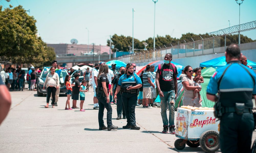 people standing on gray concrete pavement during daytime